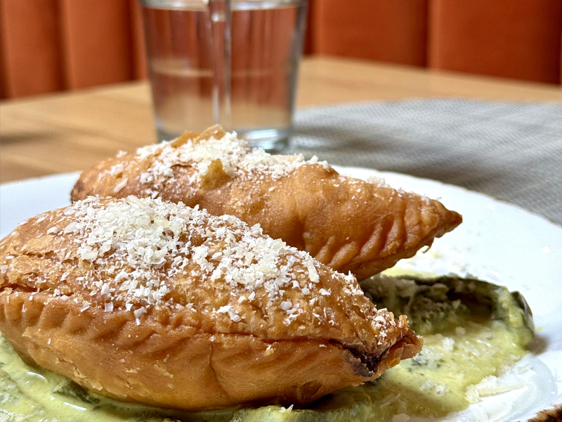 SS happy hour empanadas of the day